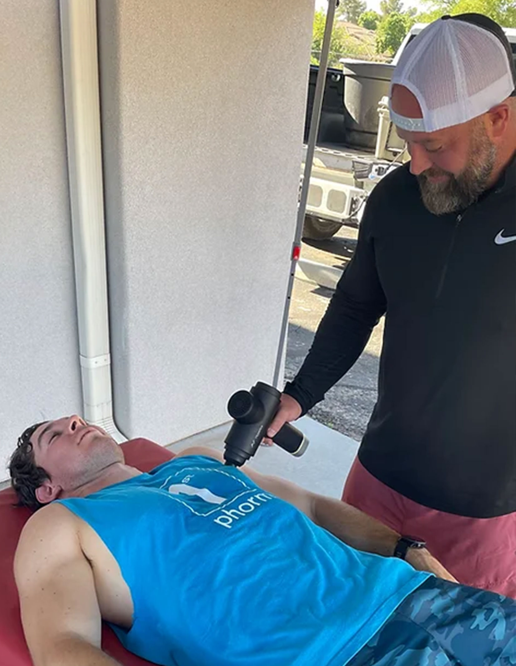 Tim Puckett helping PT patient